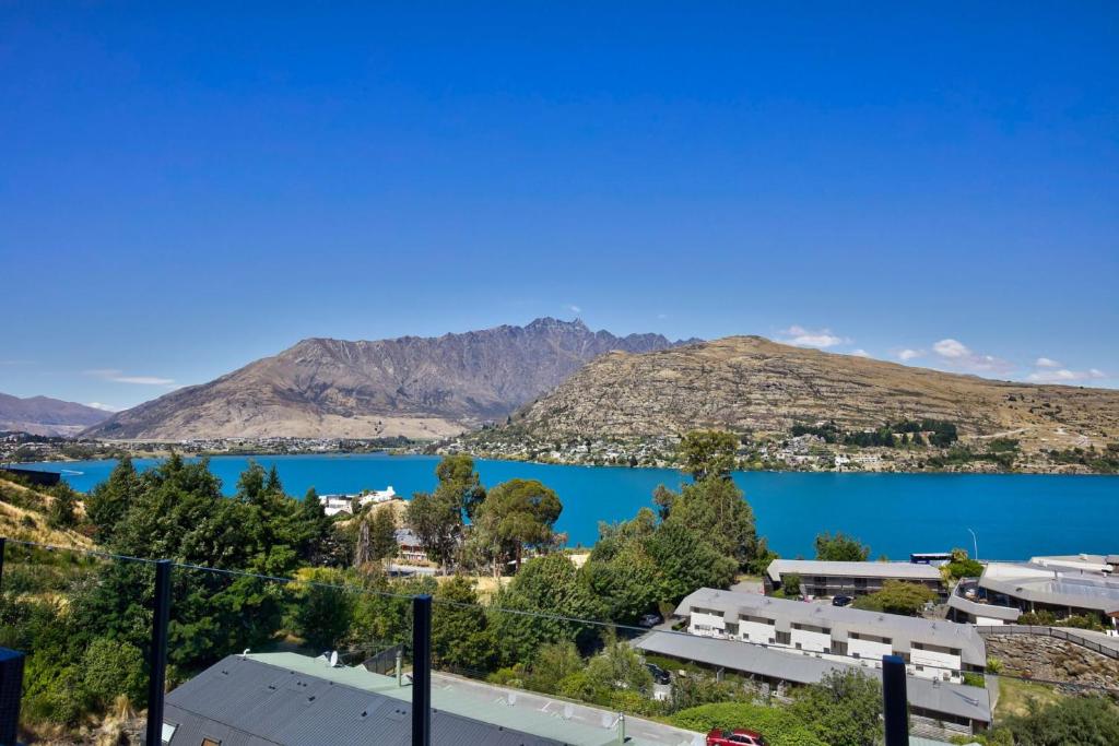 a view of a lake with mountains in the background at Goldrush Way 4BR 3BA Lake & Mountain Views in Frankton Wharf
