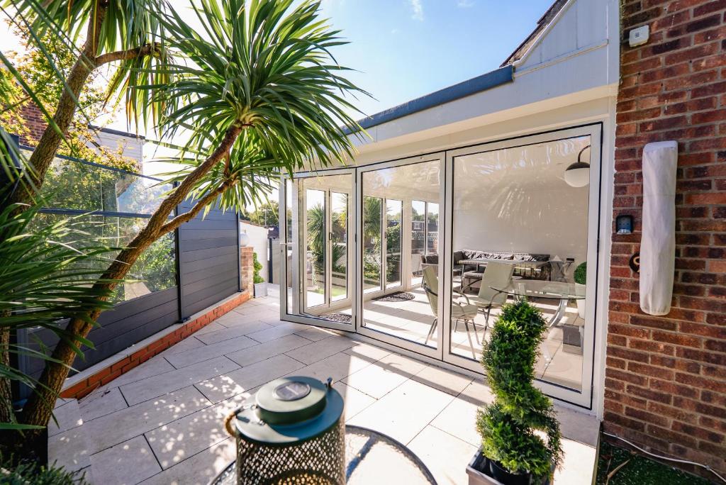 an internal view of a house with glass doors and a patio at 3 BR House With Free Parking, Garden & Fast Wifi in Cardiff