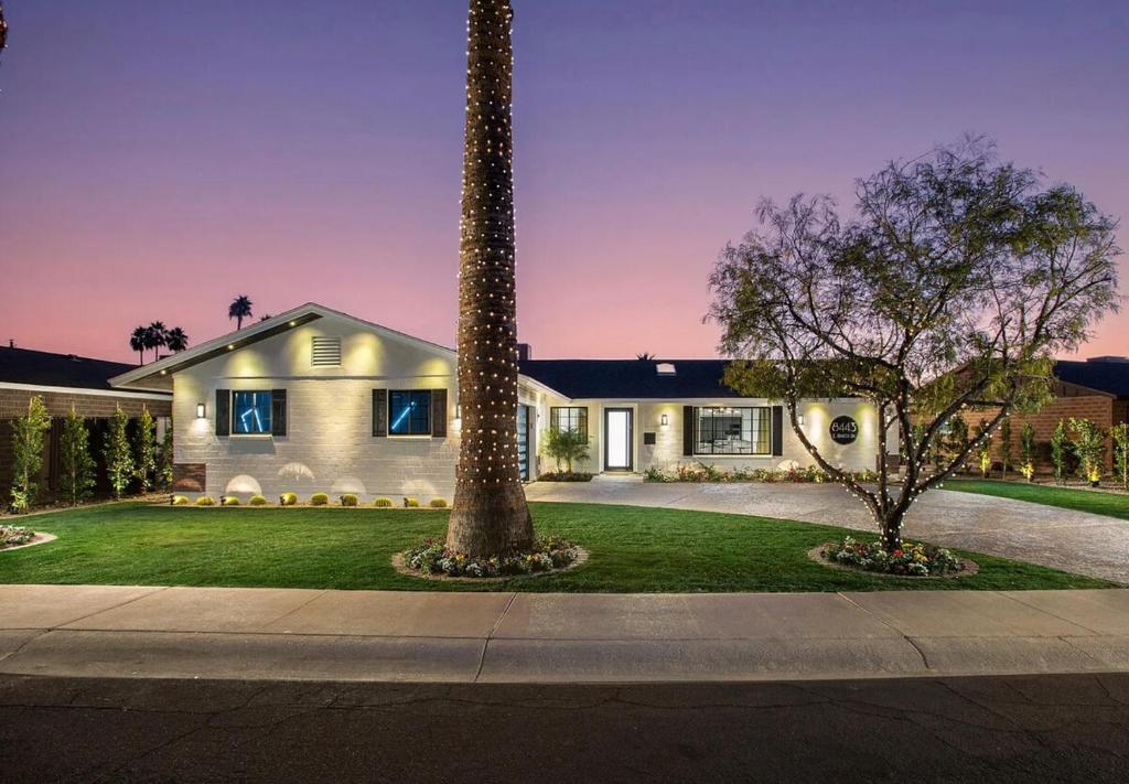 a house with a palm tree in the yard at Private Scottsdale Oasis in Scottsdale
