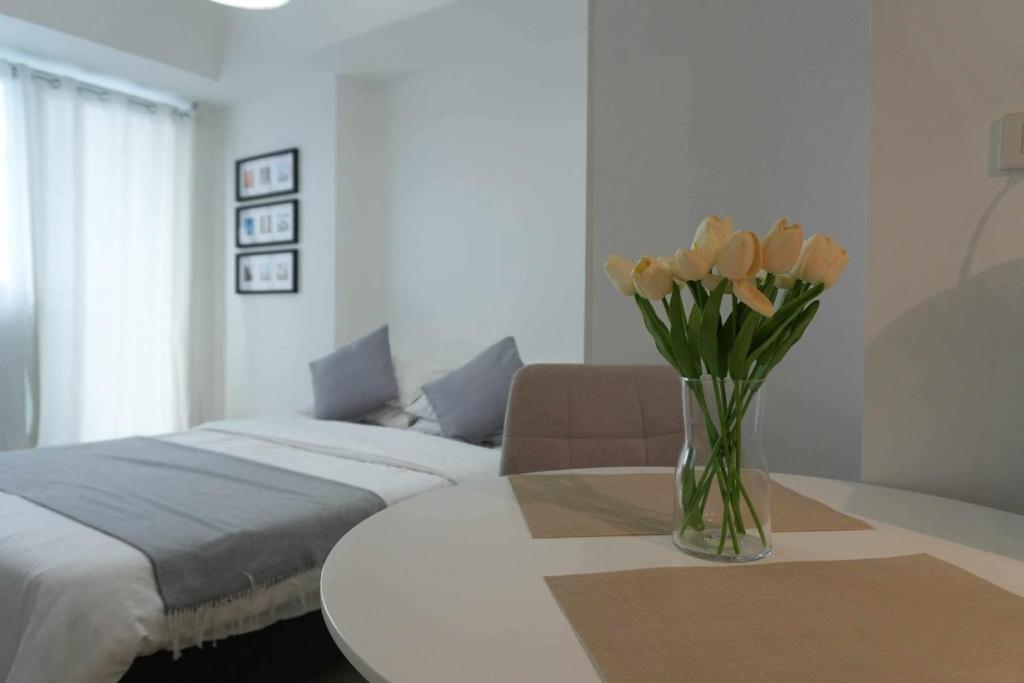 Ένα ή περισσότερα κρεβάτια σε δωμάτιο στο Unwind Elevé