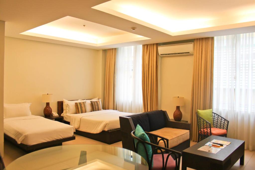 Postel nebo postele na pokoji v ubytování Azia Suites and Residences