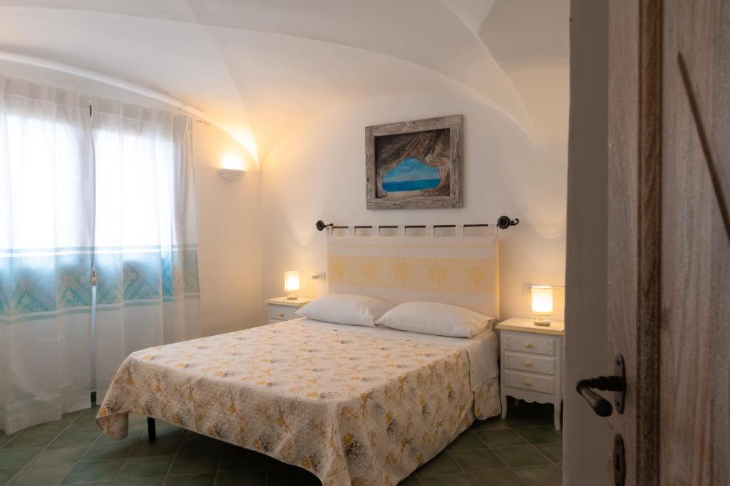 Postel nebo postele na pokoji v ubytování Tamarici