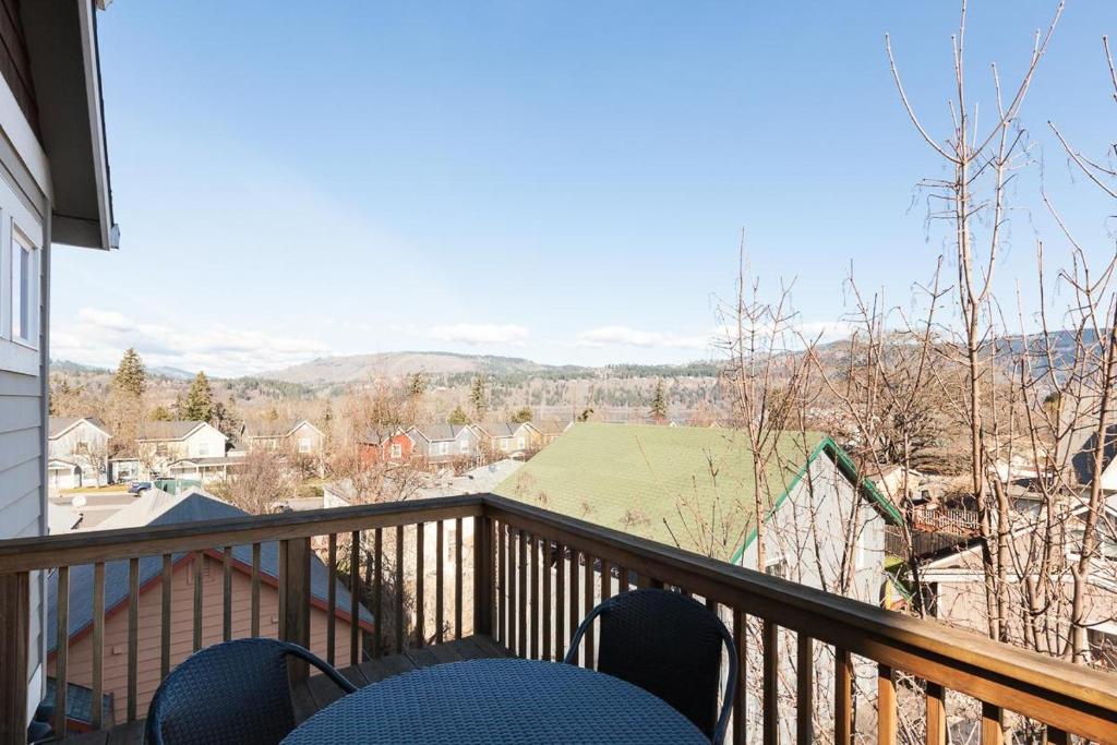 a balcony with chairs and a view of the mountains at Private Reserve 30 day minimum in Hood River