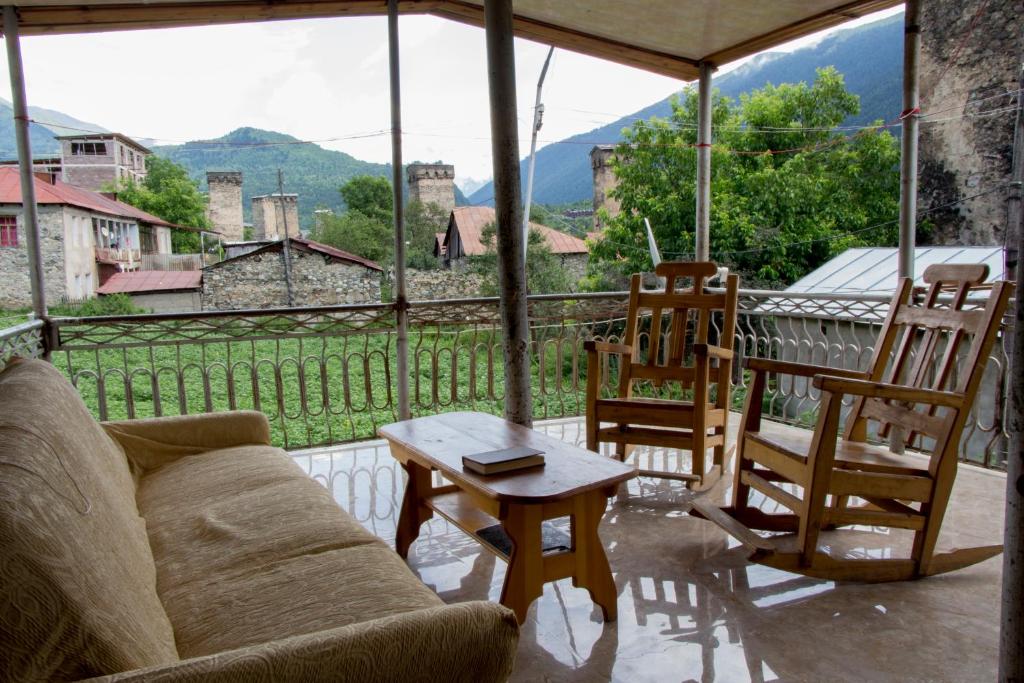 a living room with a couch and chairs and a table at Hotel Ori Beli in Mestia in Mestia