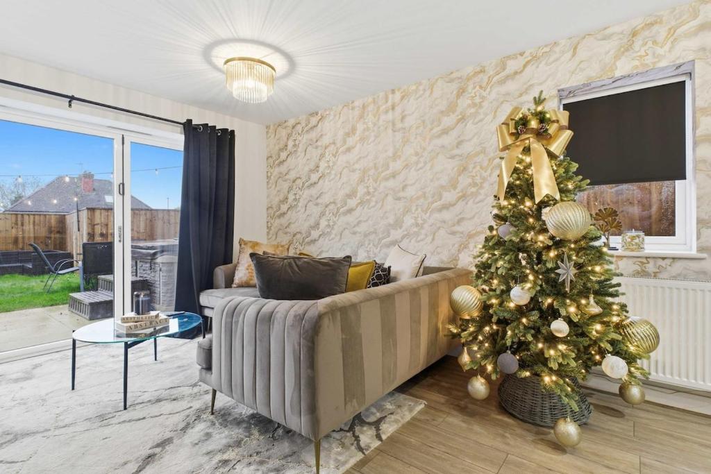 a living room with a christmas tree and a couch at Mystic Heights- Wyndale Signature Stays in Worcester