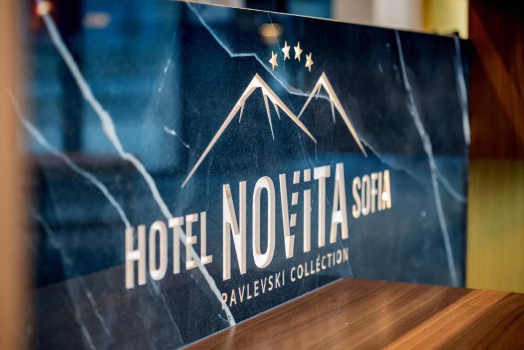 a sign for the horentina system on a table at Novita Hotel in Sofia