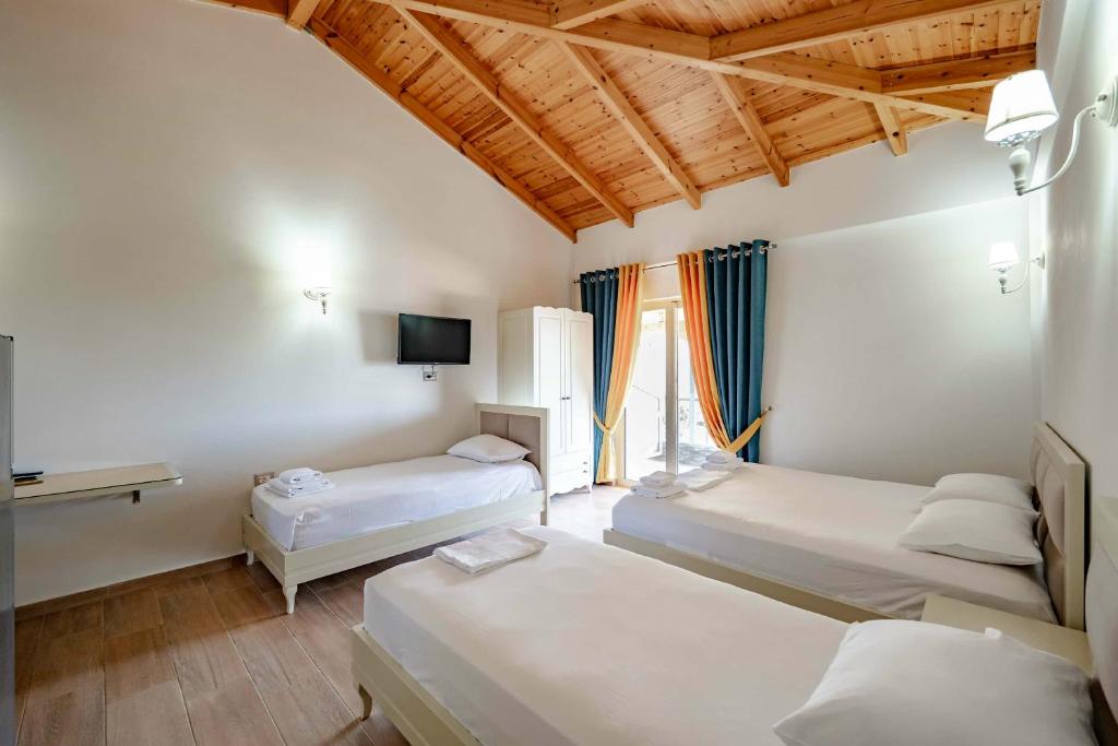 Giường trong phòng chung tại Villa Bukuroshi