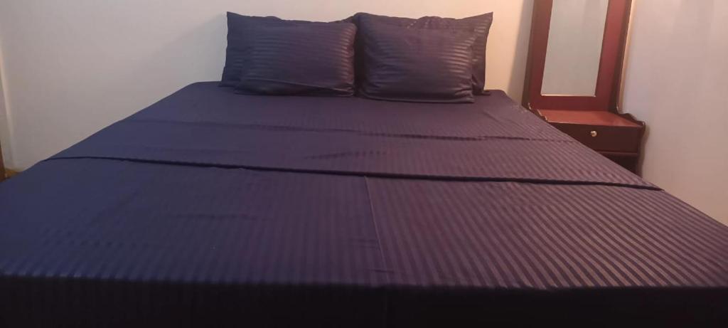 Ένα ή περισσότερα κρεβάτια σε δωμάτιο στο Yala Tropical Lodge