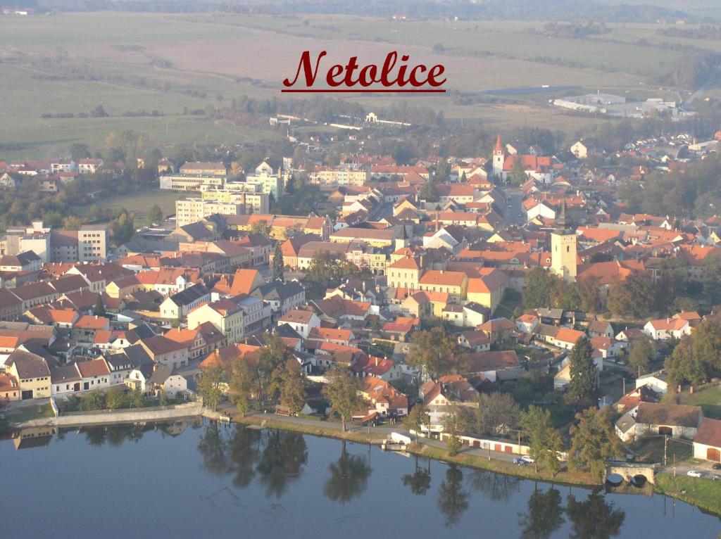 a view of a town with a river at Penzion Netolice in Netolice