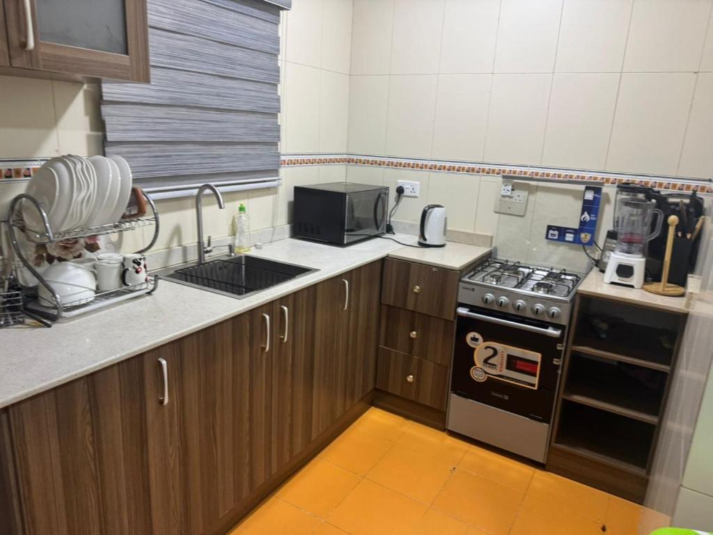 Kuchyň nebo kuchyňský kout v ubytování KumKum Apartments