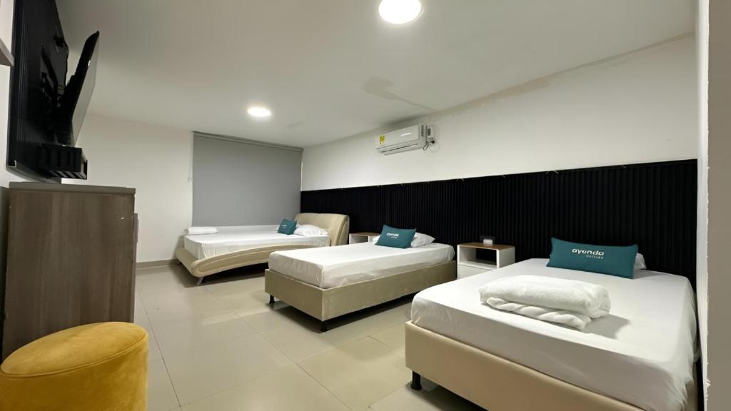 Ένα ή περισσότερα κρεβάτια σε δωμάτιο στο Ayenda Brisas del Rio