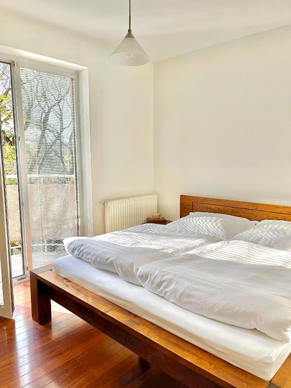 Postel nebo postele na pokoji v ubytování Apartmán Kukorelli