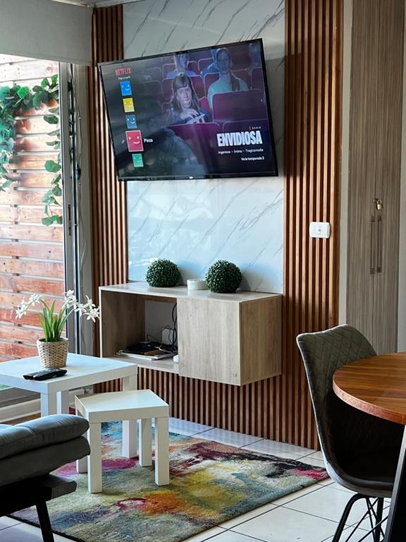 Μια τηλεόραση ή/και κέντρο ψυχαγωγίας στο Dep céntrico cercano a ex carrtera 5 - 3 habitaciones-parking-wifi