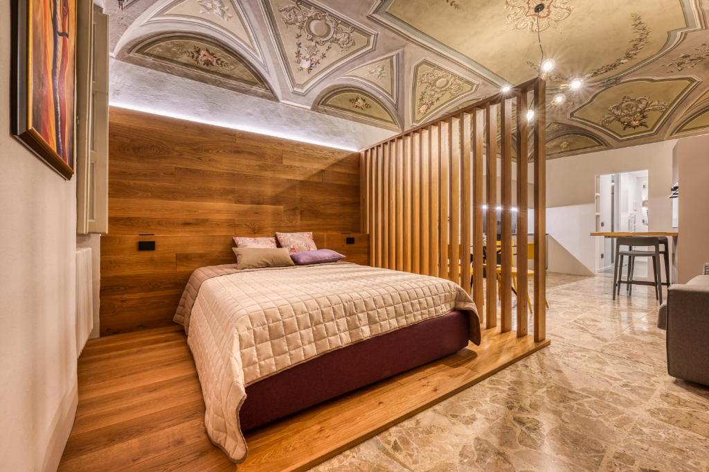 Postel nebo postele na pokoji v ubytování Grigio Perla Mondovi