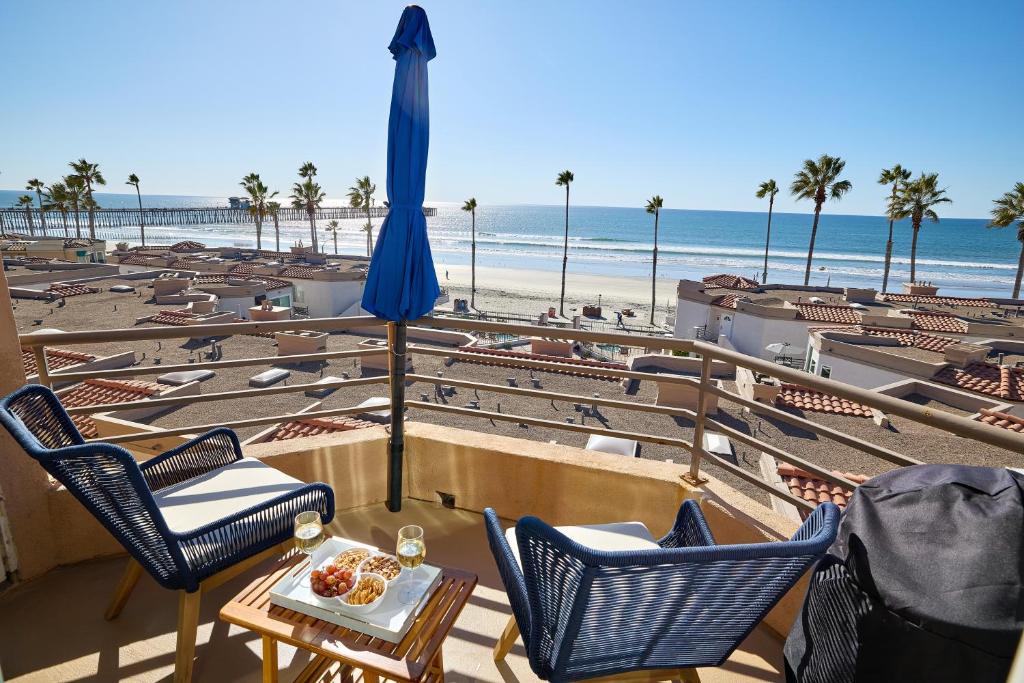 a view of the beach from the balcony of a resort at 501P-12 Spectacular Ocean Views Pet Friendly in Oceanside