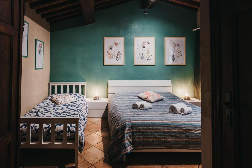 Postel nebo postele na pokoji v ubytování Cecil - La casa del Pucci