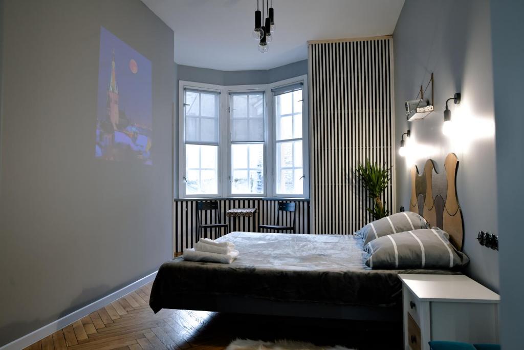 a bedroom with a bed and a window at Bolero Apart in Tallinn