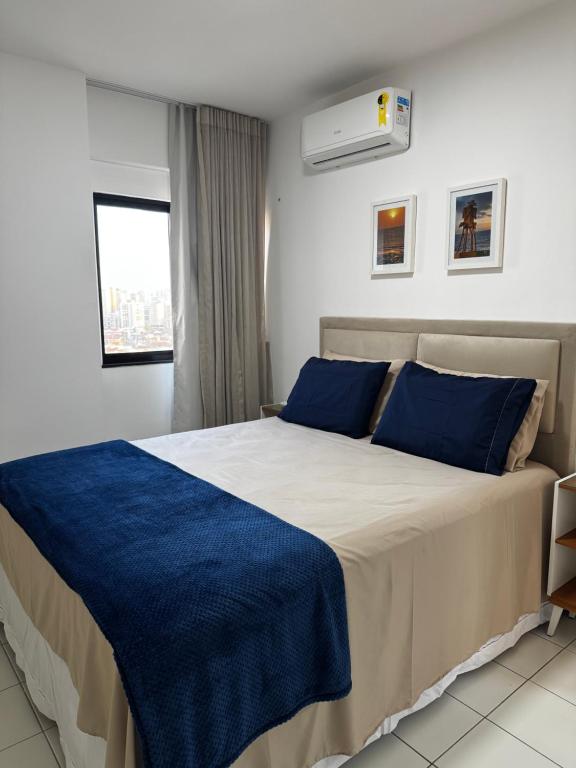 Ένα ή περισσότερα κρεβάτια σε δωμάτιο στο Flat 1106 próximo à praia - Condomínio Biarritz