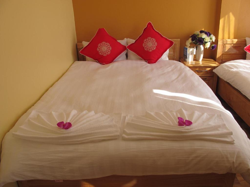 Postel nebo postele na pokoji v ubytování Sapa Backpacker Hostel