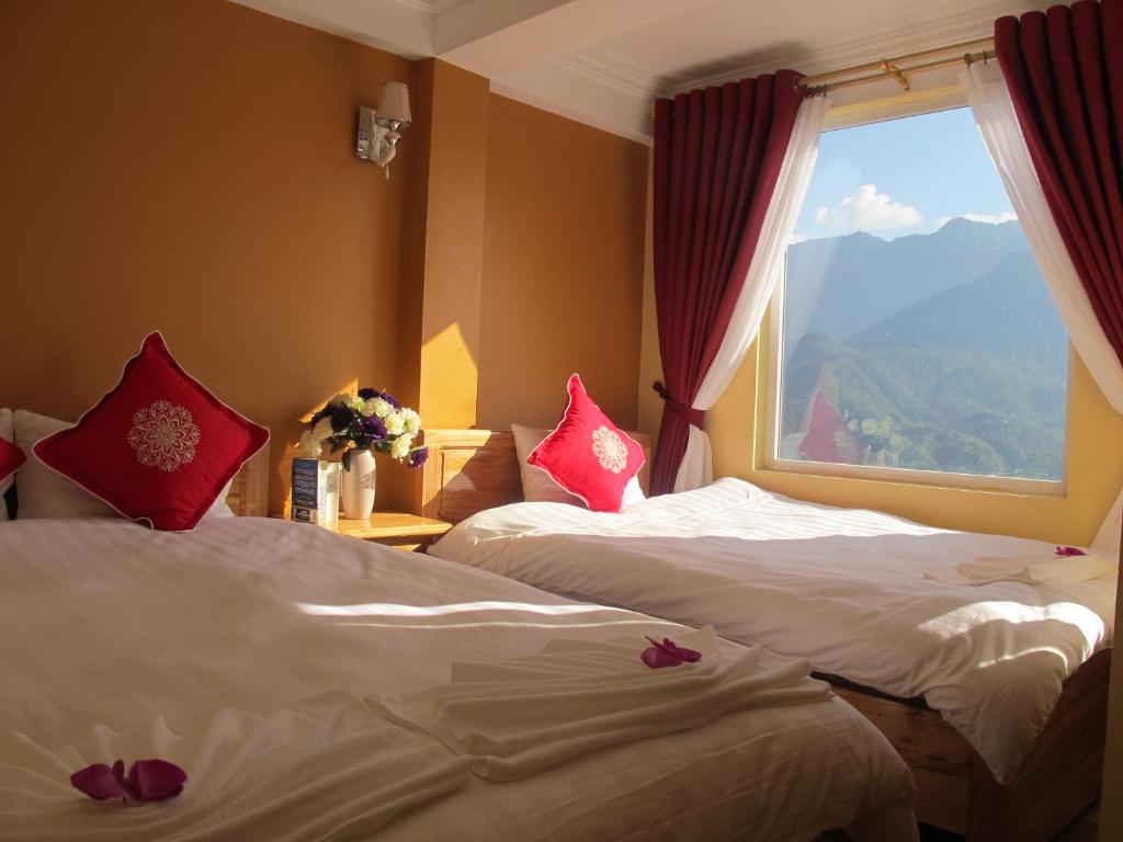 Postel nebo postele na pokoji v ubytování Sapa Backpacker Hostel