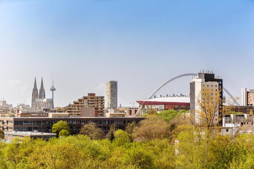 a view of a city with a bridge and buildings at Apartment Deutz in Cologne