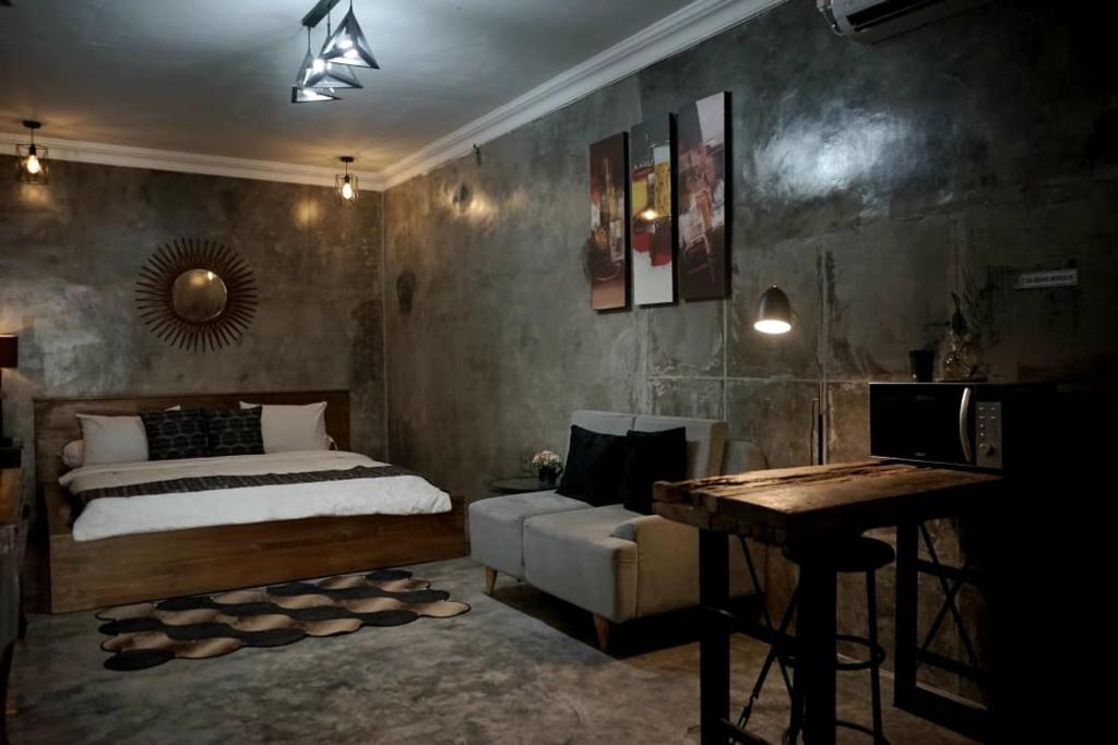 Ένα ή περισσότερα κρεβάτια σε δωμάτιο στο Lasakha Villa