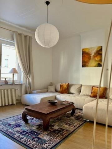 a living room with a couch and a coffee table at Chez Ninon in Freyming
