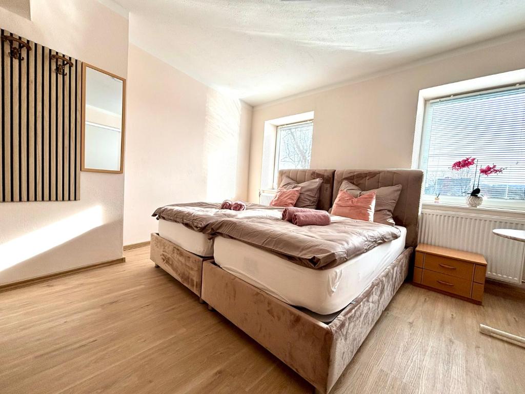 a bedroom with a bed and a window at kERVANHOF an der Donau in Kleinpöchlarn