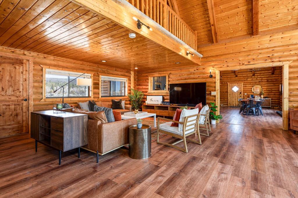 a living room with a couch and a table at Mtn Views and Fall Colors Panguitch 1-Acre Estate! in Panguitch