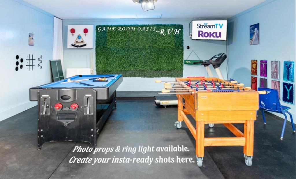 a room with a ping pong table and a table at Ultimate Game Room Oasis for 12 - Private Patio - BBQ - 2 Kings - 6 TVs - Full-Body Massage Chair in Dallas