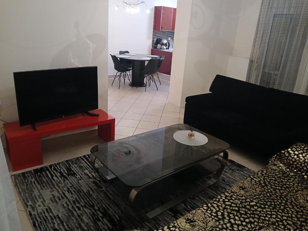 a living room with a couch and a table at sofi in Komotini