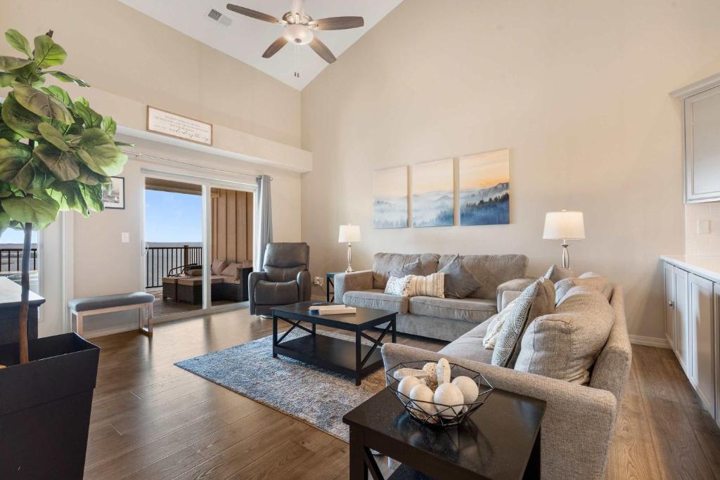 a living room with a couch and a table at The Lakeview Penthouse - 10ppl in Branson