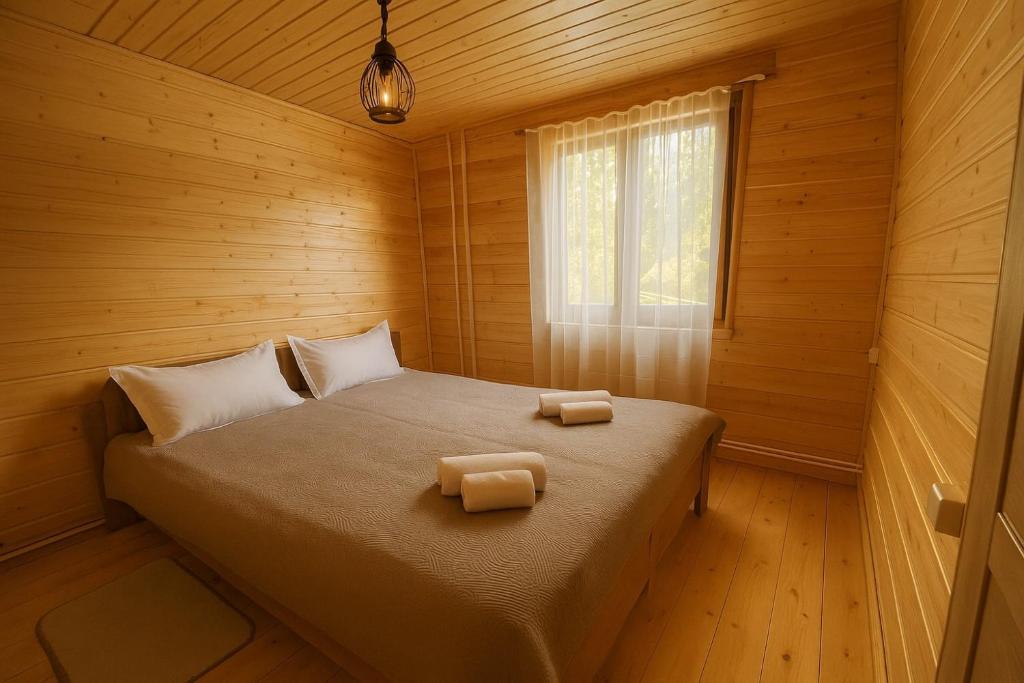 Giường trong phòng chung tại Hotel Zghapari