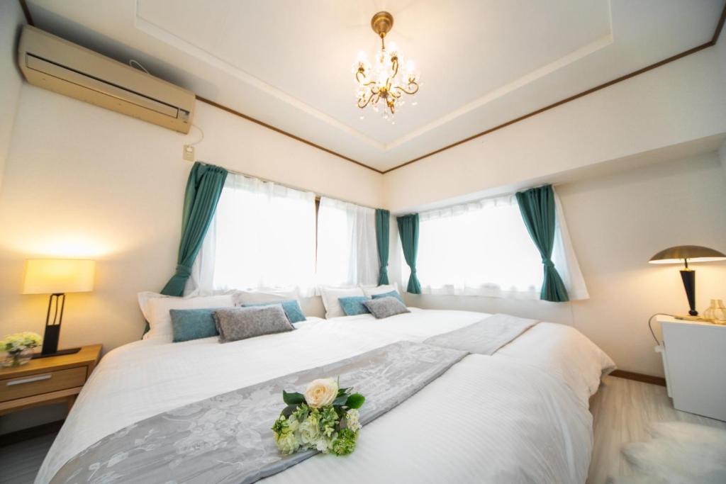 Postel nebo postele na pokoji v ubytování Awaji Egao Sakuie in Sumoto - Vacation STAY 81949v