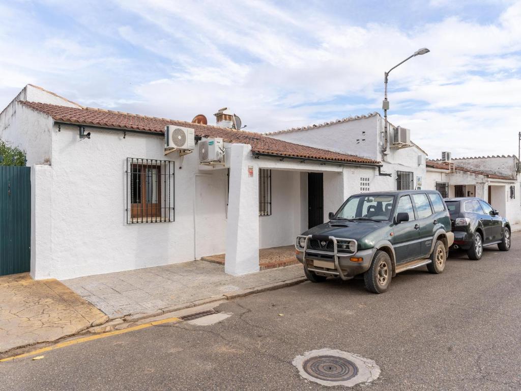 een vrachtwagen geparkeerd voor een huis bij Studio in Spain with Private Pool and Garden in Rivero de Posadas
