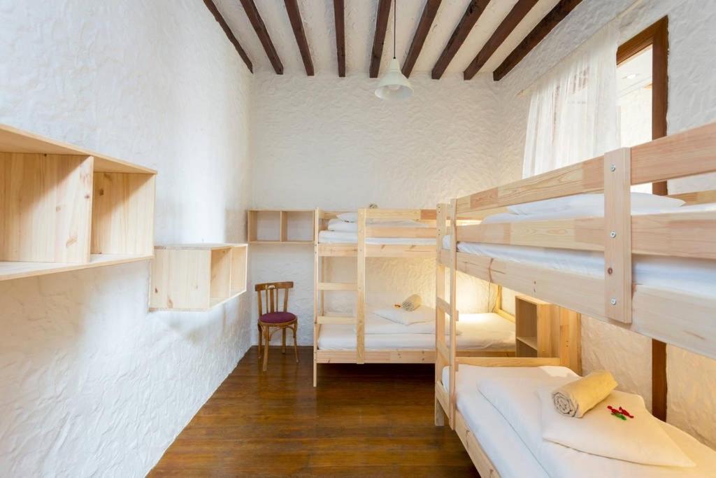 Postel nebo postele na pokoji v ubytování Sansofi Guesthouse