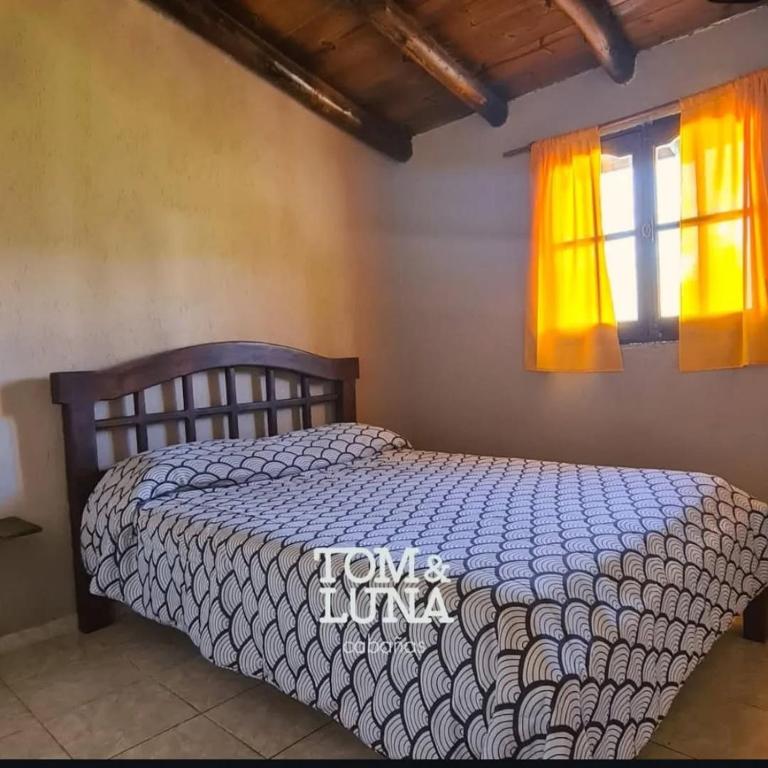 Ένα ή περισσότερα κρεβάτια σε δωμάτιο στο Tom y Luna Cabañas