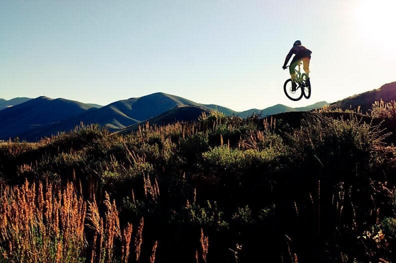 a person doing a trick on a dirt bike in the air at Sun Valley Condo 123 in Ketchum