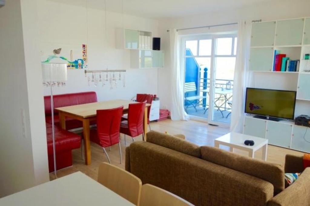 TV a/nebo společenská místnost v ubytování Sünnenhus Whg 15