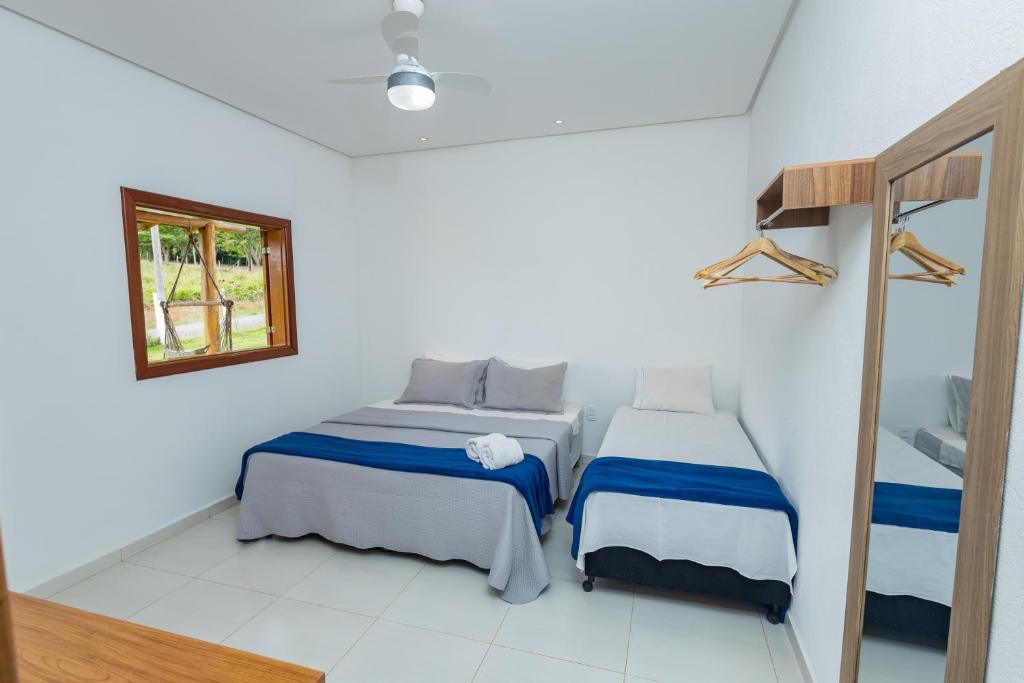 Giường trong phòng chung tại Pousada Império de Minas