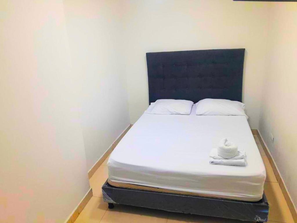 Postel nebo postele na pokoji v ubytování Apartahotel Arcoiris