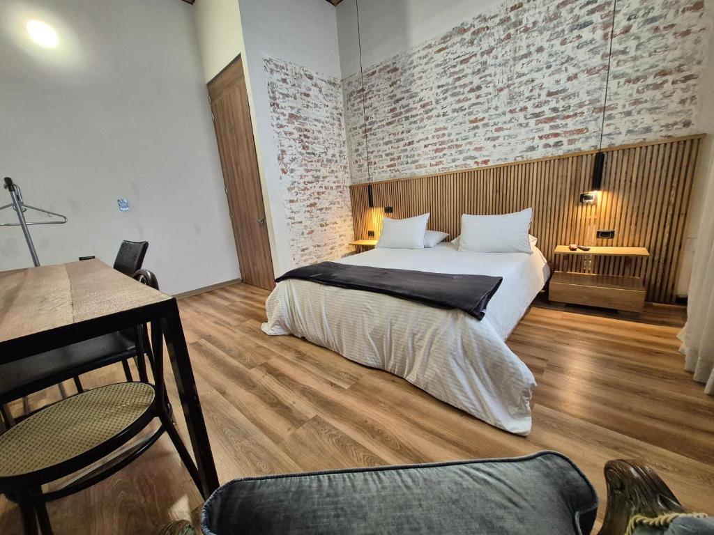 Ένα ή περισσότερα κρεβάτια σε δωμάτιο στο Pepe's House Usaquén Bogotá - Small Hotel