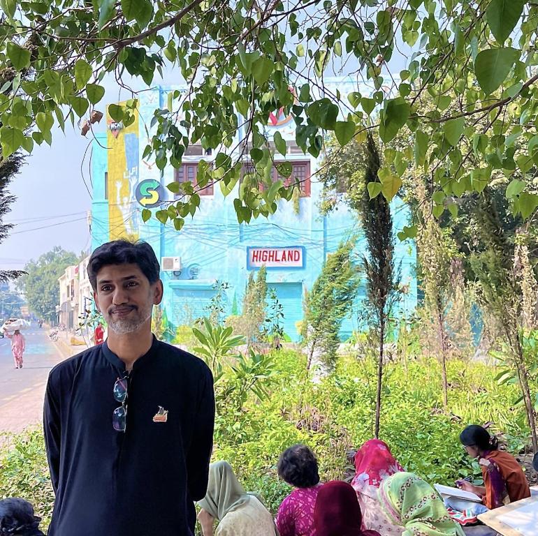 a man standing in front of a group of people at YMCA Girls Hostel, Mall Road, Lahore in Lahore