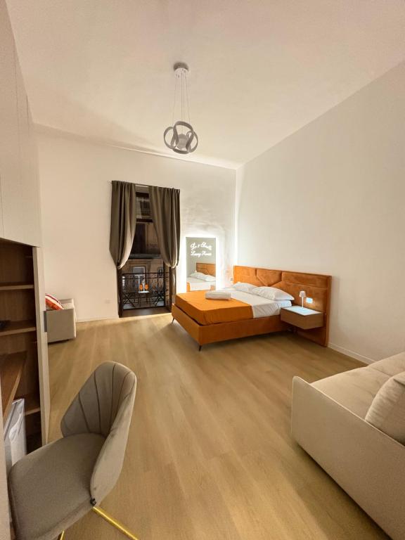 En eller flere senge i et værelse på Le 2 sorelle Luxury Rooms