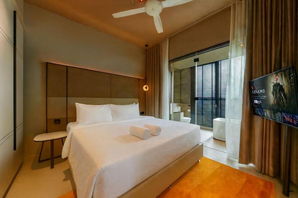 Postel nebo postele na pokoji v ubytování Antara Genting Premier Suites by Noble Nest