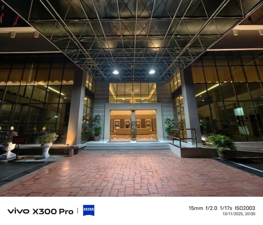 a lobby of a building with a large glass door at The Jerai Hotel Sungai Petani in Sungai Petani