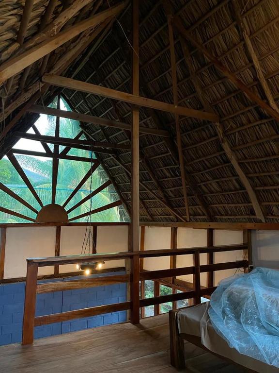 a room with a large roof with a bed in it at Fhergoshouse in Rivas