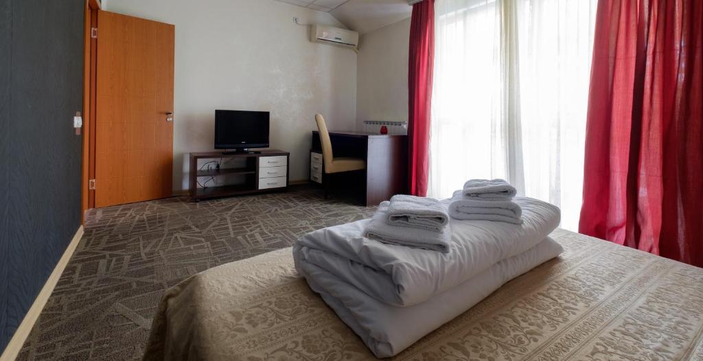 Postel nebo postele na pokoji v ubytování Villa Bulevar