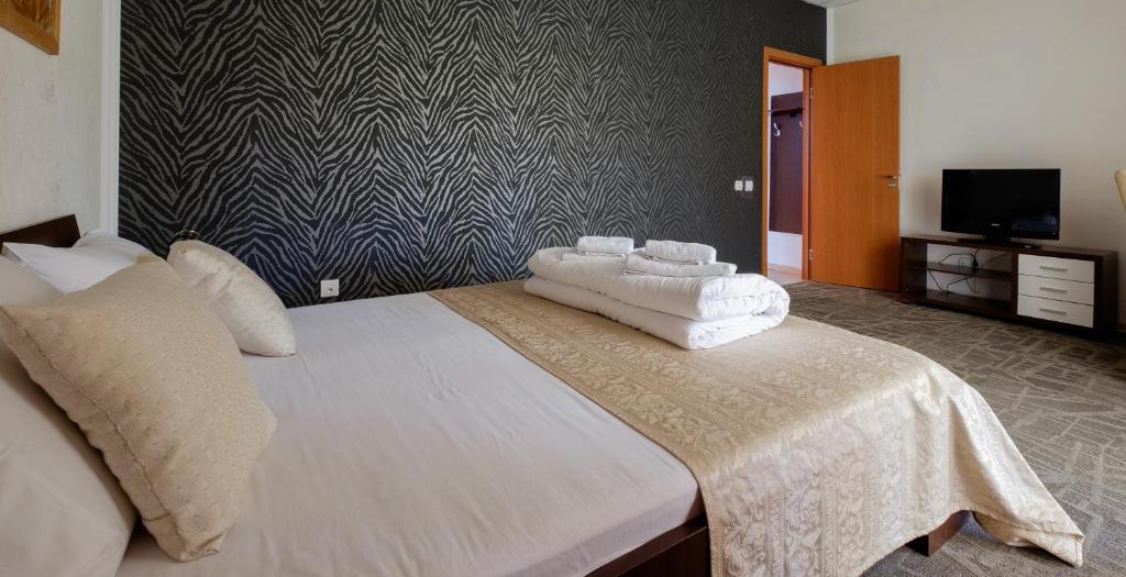 Postel nebo postele na pokoji v ubytování Villa Bulevar