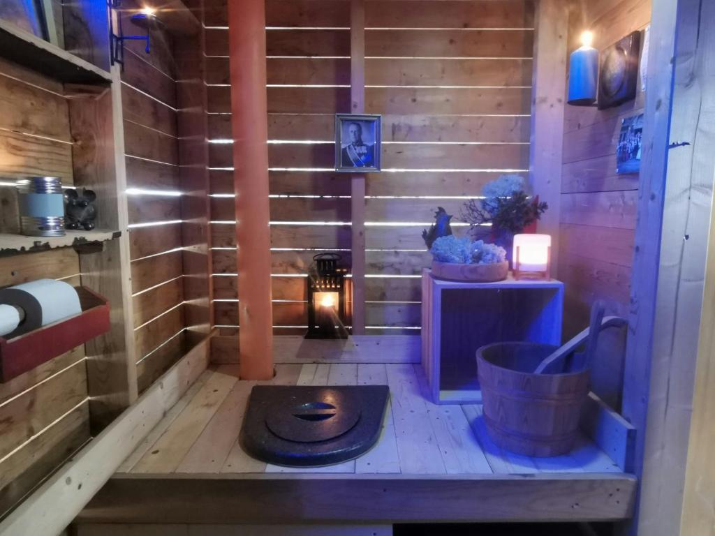 a bathroom with a toilet in the middle of a room at Ål Cabin With Panoramic Views in Favang